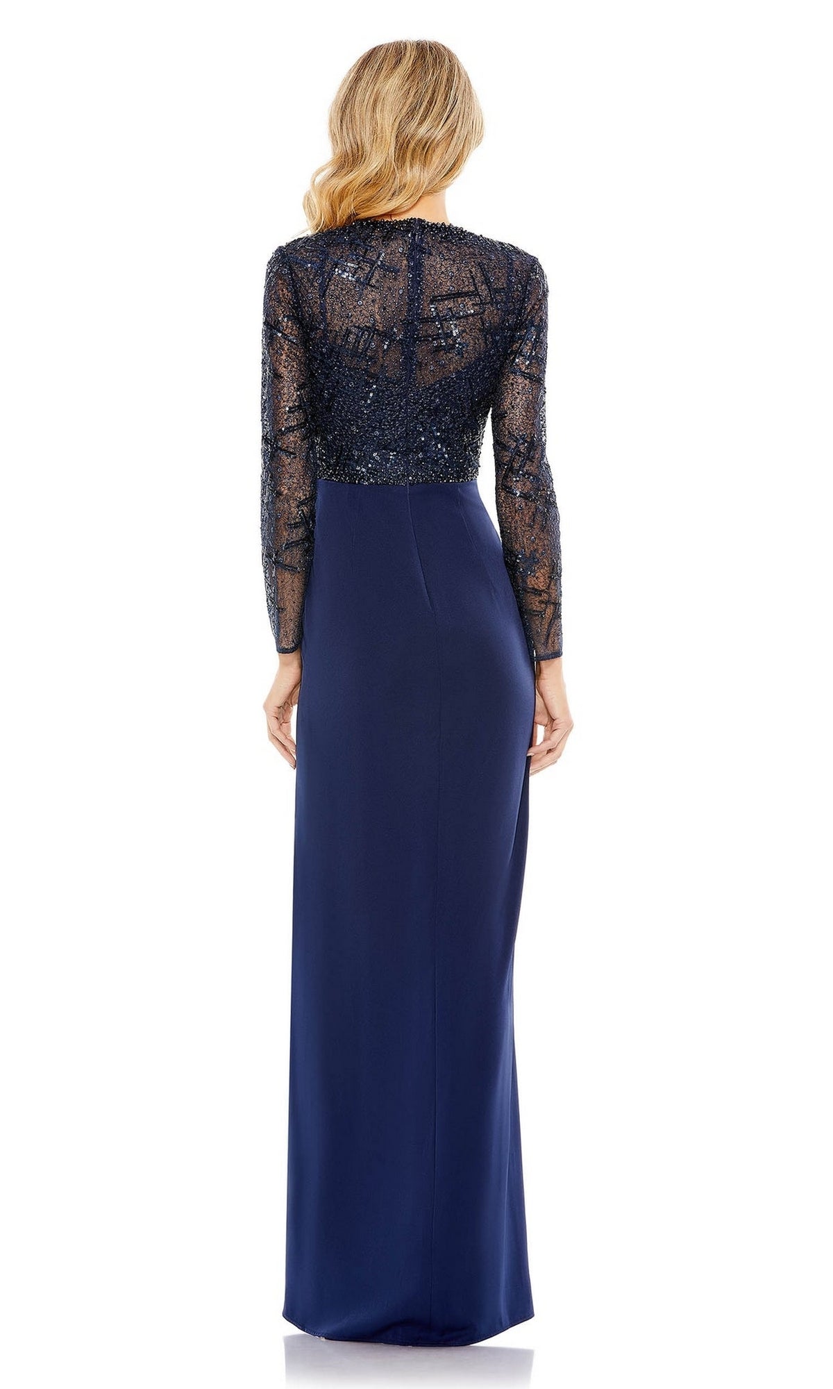 A blonde woman wears the Mac Duggal 20340 long sleeve blue formal dress with a sheer, sequined lace back and floor-length skirt, shown from behind.